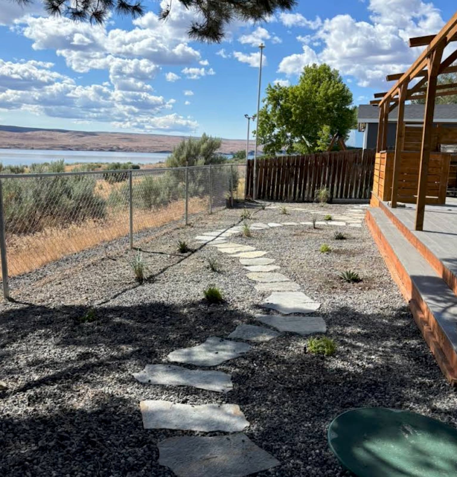 Xeriscape with flagstone path and pergola